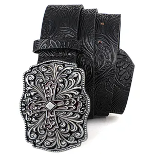 Detail showing the intricate embossed floral belt pattern and ornate vintage cross buckle design