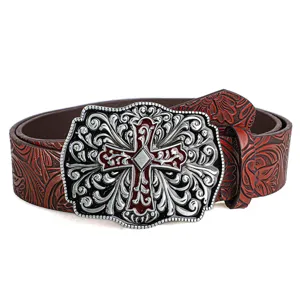 Detailed view of retro brown leather belt with ornate cross carved buckle.