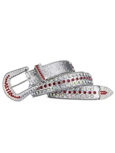 Rhinestone western belt detail close up, sparkling crystal studded leather strap with metal buckle.