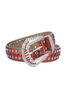 Close-up detail of the red glitter rhinestone western belt with ornate metal buckle and studs.