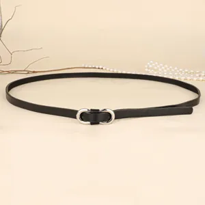 Detailed close-up of a slim black leather belt with a silver figure-eight buckle