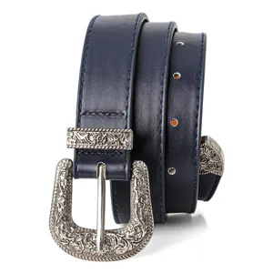 Close-up detail of navy blue vintage belt with intricate silver engraved buckle set