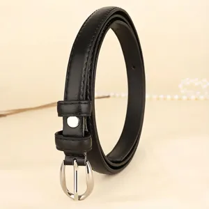 Detailed view of a slim black leather belt for women featuring a polished silver buckle