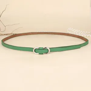 Detail view showing the green leather texture and silver double circle metal buckle design.