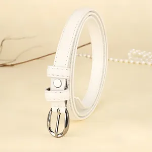 Close-up of elegant white skinny leather belt with silver-tone oval buckle