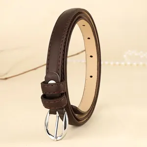 Side view of slim brown leather belt for women featuring a polished silver buckle