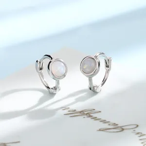Elegant small silver hoop earrings featuring round white opal stone insets for daily wear.