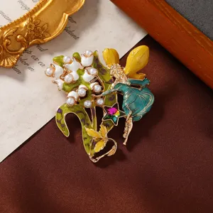 Close-up macro view of the exquisite fairy enamel brooch featuring pearls and floral details