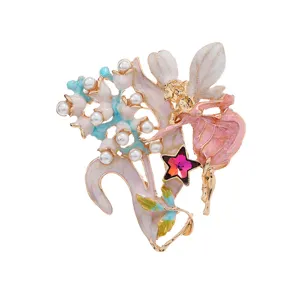 Elegant enamel fairy brooch featuring delicate pearls and a vibrant red star crystal