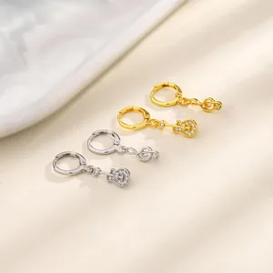 Asymmetrical guitar and treble clef musical note hoop earrings in gold and silver finish