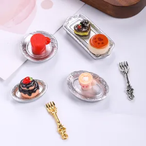 Detailed view of miniature dollhouse western food set with silver plates and desserts