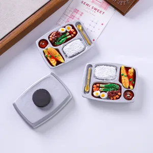 Detail of miniature bento box refrigerator magnet with realistic resin food decor