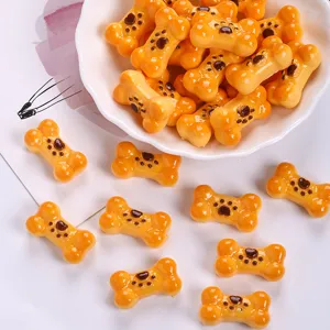 Detailed macro shot of cute resin bone biscuit charms for DIY jewelry and accessories
