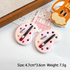 Detailed close-up of pink miniature resin artist palette for DIY crafts, 4.7x3.6cm size