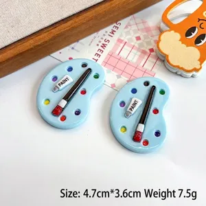 Detail view of miniature artist palette resin charm with size and weight specs