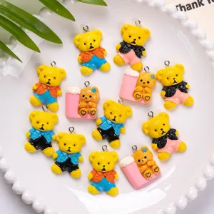 Detailed view of colorful resin teddy bear charms for DIY crafts and accessories
