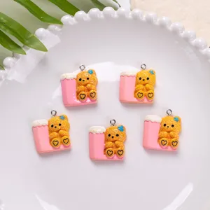 Detailed view of cute resin teddy bear charms for DIY jewelry and phone case decor