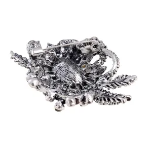 Detailed back view of a vintage floral brooch with antique silver finish and secure pin clasp