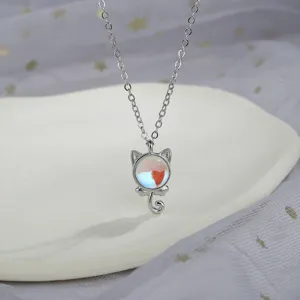 Detailed close-up view of a cute silver cat pendant necklace with colorful moonstone
