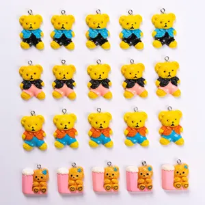 Grid display of colorful resin teddy bear charms showcasing different outfit styles and colors.