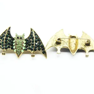 Detailed view showing front and back of the vintage rhinestone bat brooch jewelry pin