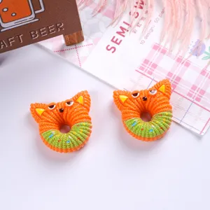 Detailed top view of two cartoon fox-shaped resin donut accessories for DIY.