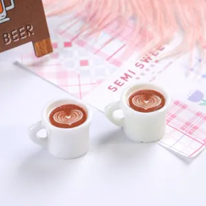 Detailed macro shot of miniature resin coffee cups with heart latte art design