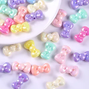 Detailed macro view of colorful AB coated acrylic bow beads for DIY jewelry crafting
