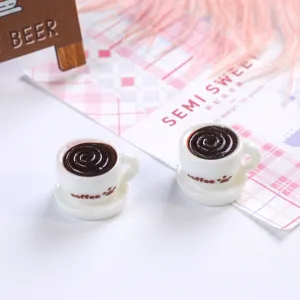 Two miniature resin coffee cups with cute cat paw prints for dollhouse scene