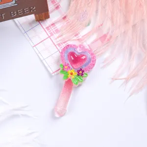 Detailed view of pink glitter heart magic wand resin accessory for DIY phone cases and hair clips