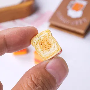 Detailed close-up of a realistic miniature resin toast slice for dollhouse DIY craft