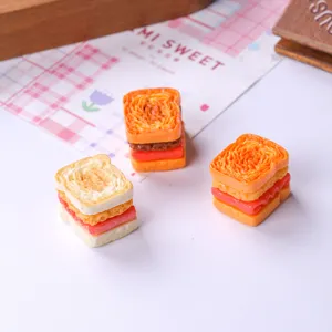 Detailed view of three miniature resin sandwich bread pieces for DIY dollhouse decoration
