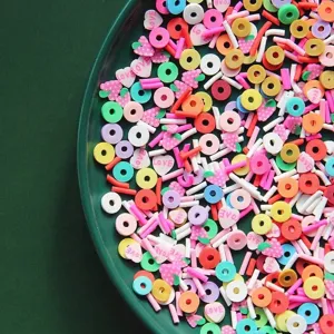 Macro view of mixed colorful polymer clay slices in various shapes for DIY crafts