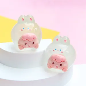 Close-up of translucent glow-in-the-dark jelly-colored bunny cartoon figurines for DIY crafts
