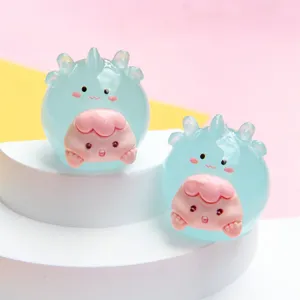Detailed view of two cute jelly-colored glowing cartoon animal resin figurines for DIY crafts