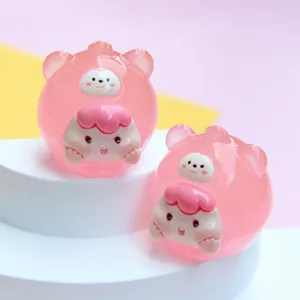 Macro view of two cute pink jelly resin cartoon animal figurines for DIY crafts