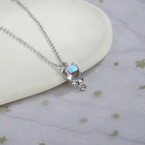 Close-up detail of a silver cat pendant necklace with a beautiful iridescent moonstone inlay