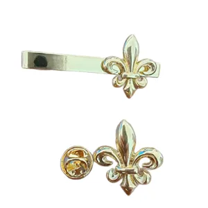 Elegant gold-plated Fleur-de-lis tie clip and lapel pin set for men's professional formal wear.