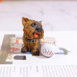 Detailed macro shot of a miniature dog figurine standing next to a small realistic baseball