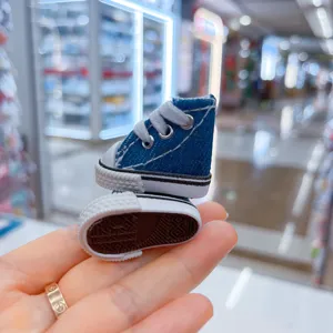 Detailed view of 3.5cm miniature blue denim canvas shoes for dolls and keychains