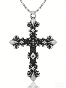 Macro detail of vintage cross flower pendant necklace with antique silver finish