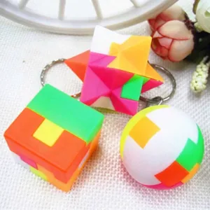 Detailed view of mini 3D puzzle keychains in cube, ball, and star shapes.