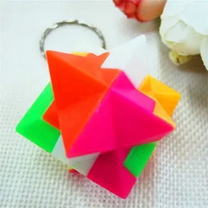 Close-up of 2.5cm colorful 3D puzzle ball keychain with interlocking blocks