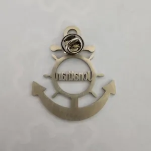 Detailed view of nautical anchor and helm stainless steel brooch with brushed silver finish