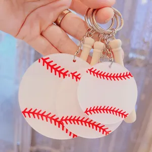 Detailed macro view showing three acrylic baseball keychains with red stitching prints