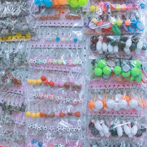 Wholesale display of sports mini ball keychains including bowling, tennis, and golf styles.