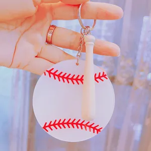 Detailed view of a creative acrylic baseball keychain featuring a mini wooden bat charm