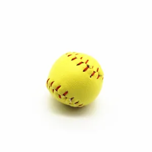 High quality macro view of a mini yellow softball featuring realistic red stitching