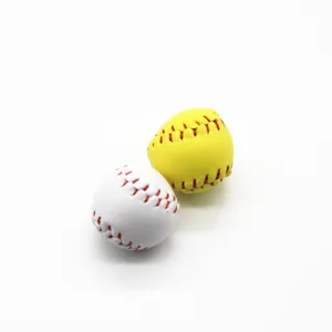 Close-up view of mini baseball and softball charms with realistic red stitching details.
