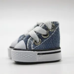 Close-up of 3.5cm mini blue denim canvas doll shoes featuring white laces and rubber soles